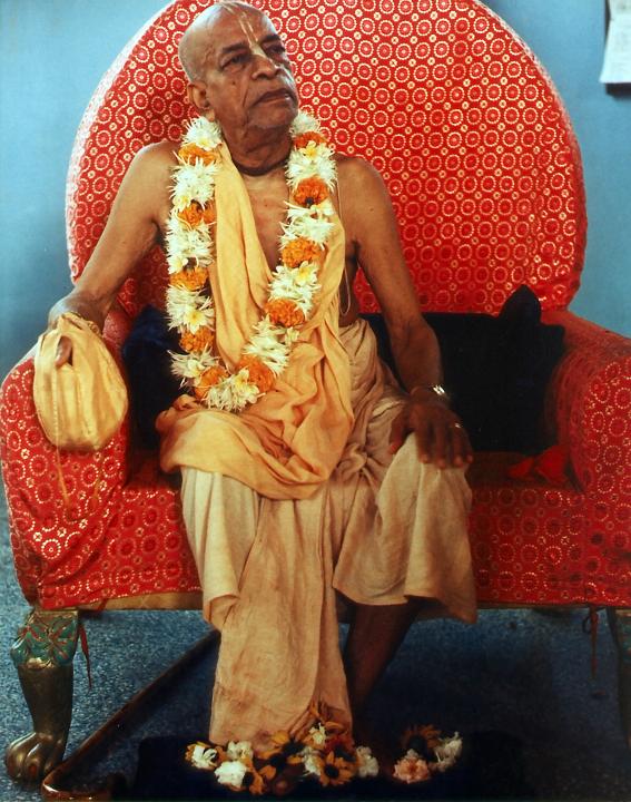 Srila Prabhupada Sitting Chanting Hare Krishna on Japa Beads